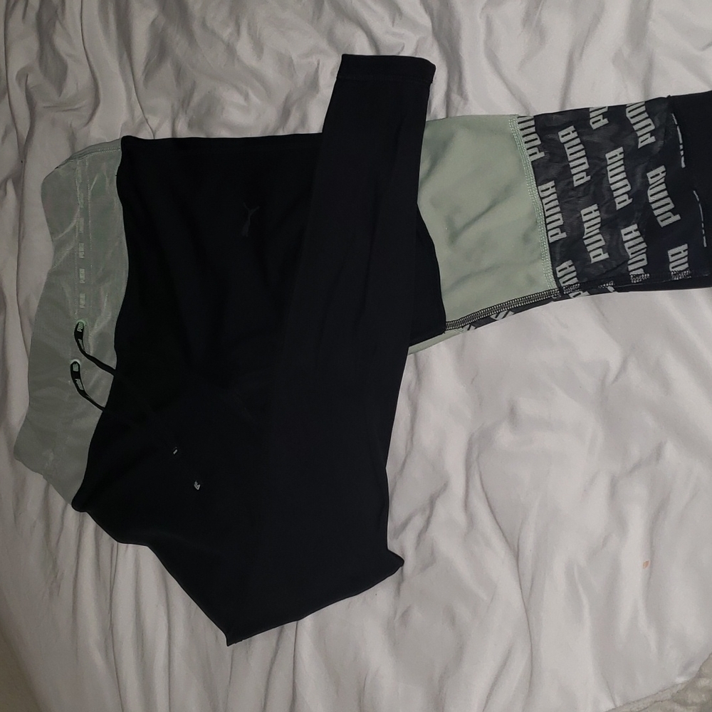 Puma leggings size M. Black and pistachio green , mesh Puma print on left leg.